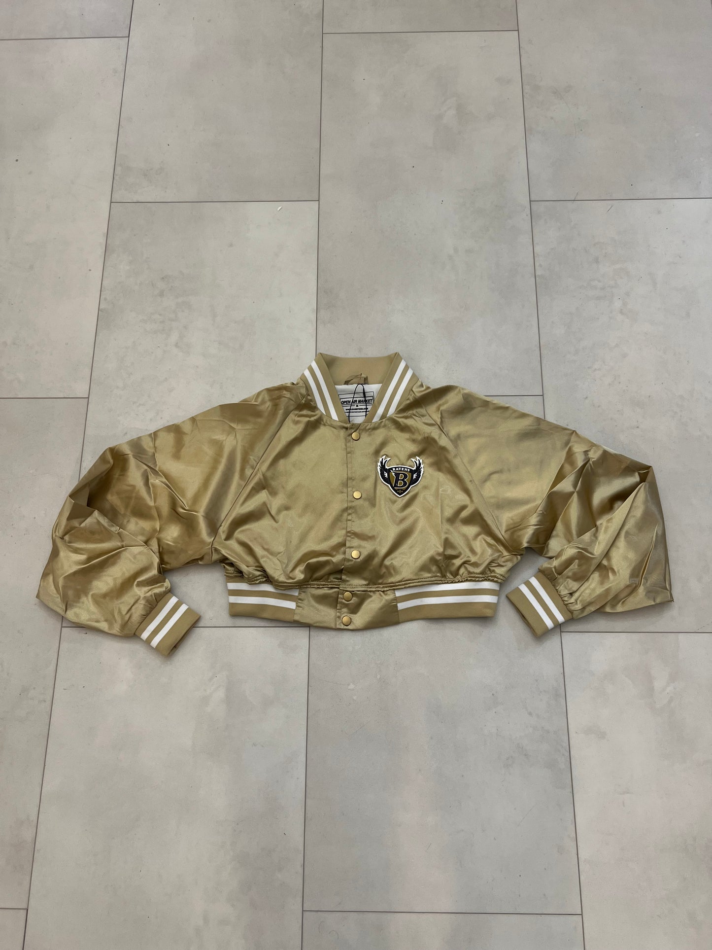Cropped Satin “Ravens” sideline jacket.